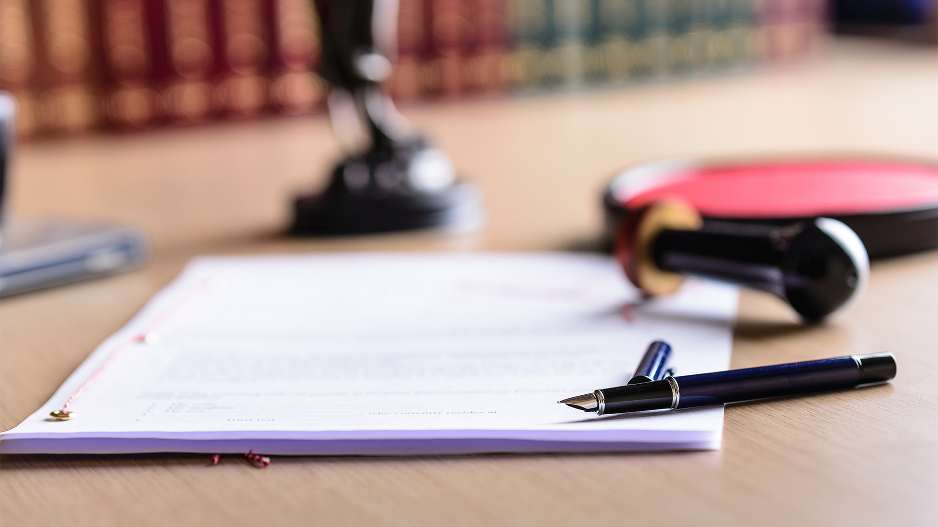 Contract waiting for a notary public sign on desk.